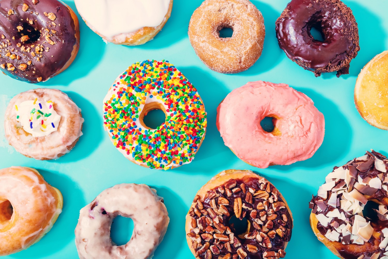 BM_Assorted donuts on pastel blue background_96284524