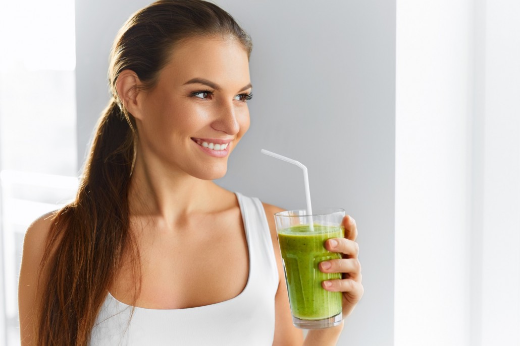 BM_Healthy Eating Woman Drinking Fresh Raw Green Detox Vegetable Juice_96241546