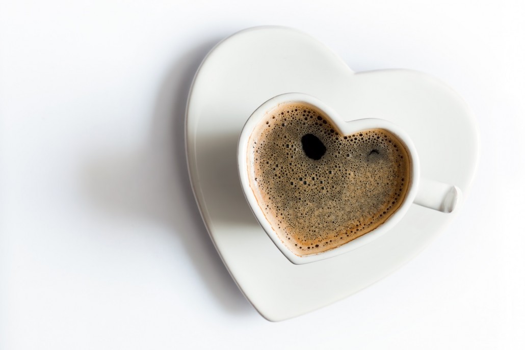 BM_Heart shaped cup of black coffee on white. Love_73874935
