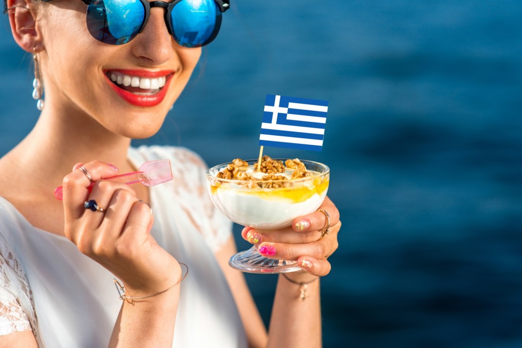 BM_Woman eating greek yogurt_83657546