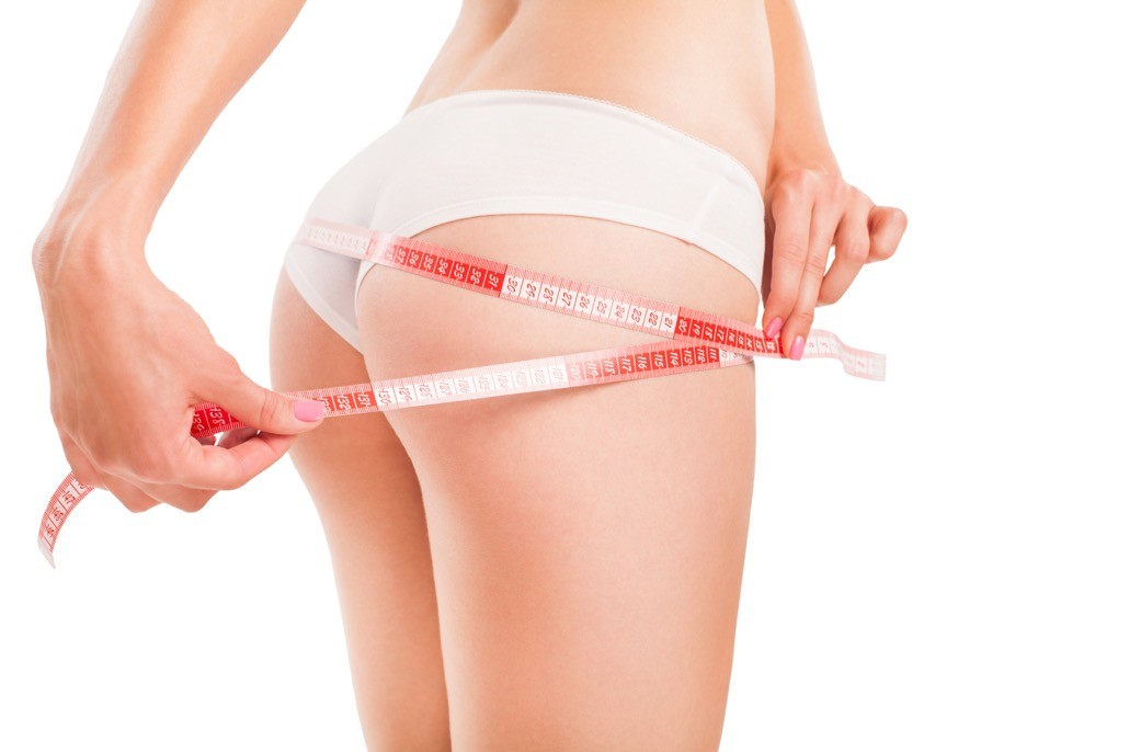 BM_Body of woman with a measuring tape_93202119