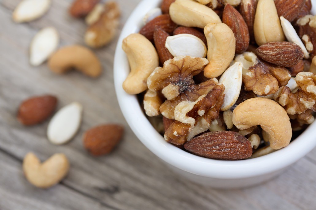 BM_Bowl of Mixed Nuts on Rustic Wooden Table_98745230