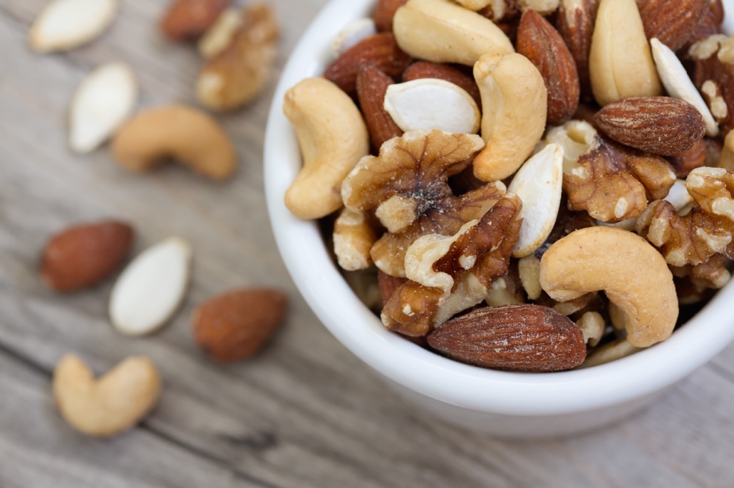 BM_Bowl of Mixed Nuts on Rustic Wooden Table_98745230