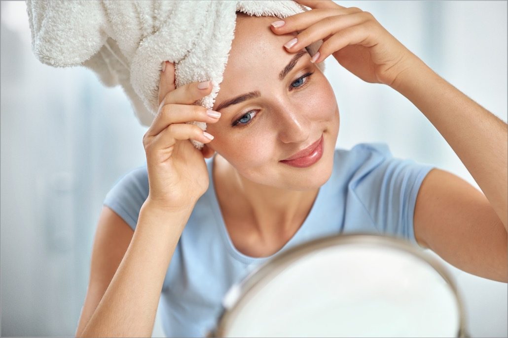 bm_a-young-brunette-woman-with-a-towel-wrapped-round-her-head-exam_125217908