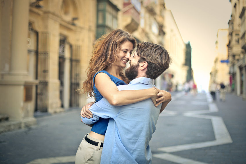 50742607 - in love man lifting hi girlfriend in a hug